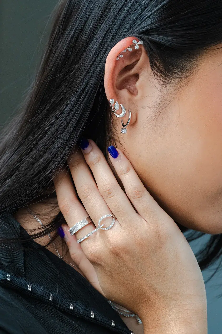 Diamond rings stacked across two fingers
